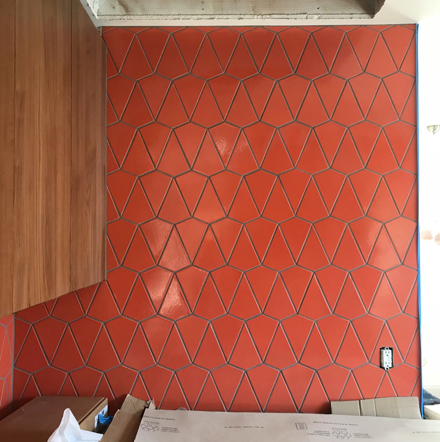 Progress photo of the backsplash installation.